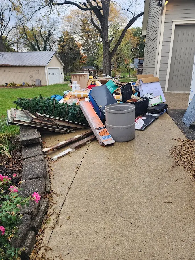 Dumpster being loaded with debris for Residential Dumpster Rental in Hoquiam